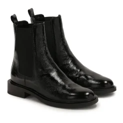Chaussons noirs à effet froissé.Ce produit taille grand.