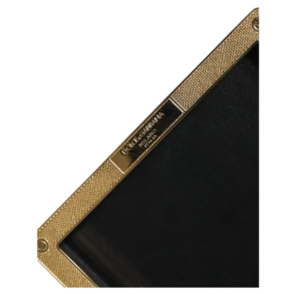 Pochette en cuir noir à clous dorés